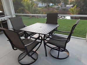 Outdoor dining - New house completed in Mar 2022 with pool and tiki bar! 15 min. to Gulf Beaches. (Englewood)