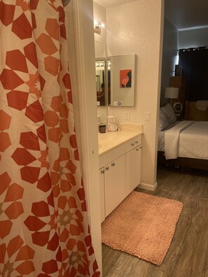 Combined shower/bathtub, towels, toilet paper