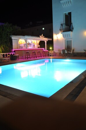A swimming pool with a bar area and outdoor seating. - HANBABA HOTEL (Bodrum)