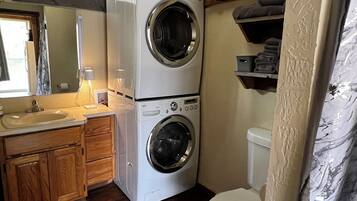 Shower, towels, shampoo, toilet paper