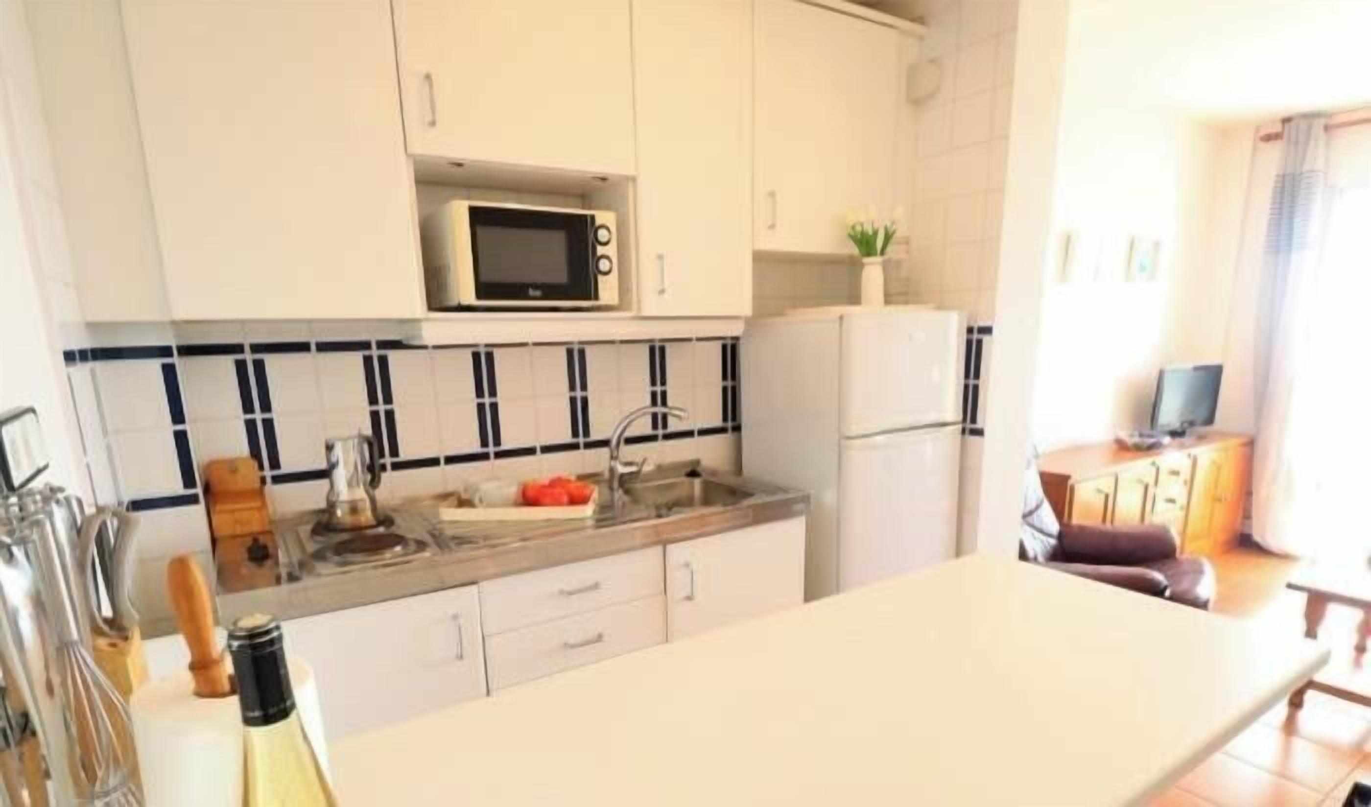 Fridge, microwave, coffee/tea maker, toaster