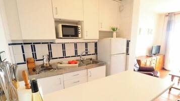 Fridge, microwave, coffee/tea maker, toaster