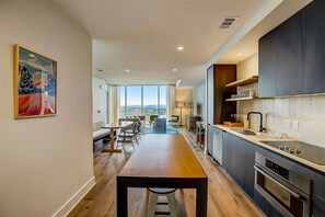 Fridge, microwave, oven, stovetop - Rainey Street condo w/lake & sunset-view balcony - rooftop pool & gym (Austin)