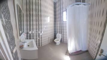 Shower, towels, soap, toilet paper