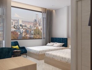 Habitación cuádruple Deluxe | Escritorio, wifi gratis y ropa de cama 