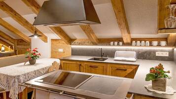 Fridge, stovetop, dishwasher, coffee/tea maker