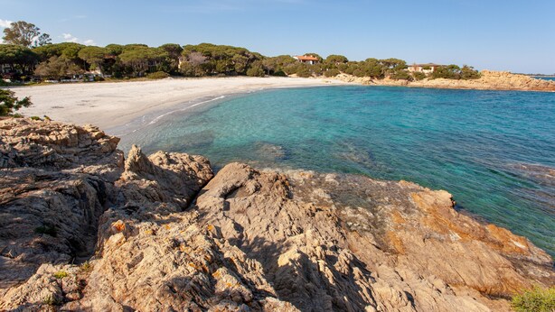 A coastal landscape with rocky terrain, clear turquoise waters, and a sandy beach. - Holiday Apartment "Casa Antonella" with Garden, Balcony & Air Conditioning (Orosei)
