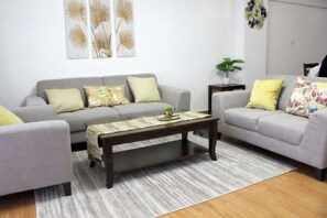 Executive Apartment | Living area | 20-inch Smart TV with digital channels, TV - Stay.Plus Hurlingam Family Apartment (Nairobi)