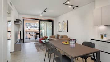 Apartment, City View | Living area | 55-inch Smart TV with digital channels, TV, Netflix