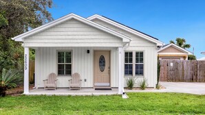 A single-story house with a front porch, two chairs, and a mailbox. - Point Three + Pool, Bikes, Nearby Beach & Sunroom (Panama City Beach)