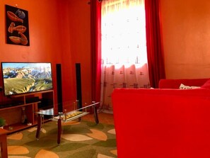 Comfort Apartment, 1 Bedroom | Living area | 20-inch Smart TV with digital channels, TV - Stay.Plus Arujo Apartment Homa Bay (Homa Bay)