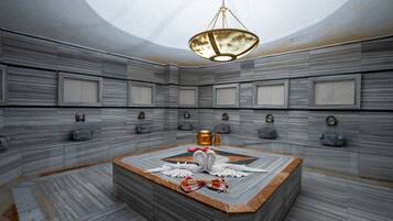 Bathroom features a large bathtub, rectangular panels, and a skylight.