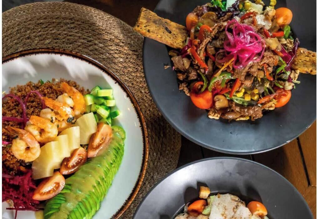 Three plates of food with various ingredients.