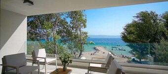 Beachfront Villa Erce with private 40sqm heated pool, a Gym, 7 en-suite bedrooms, a rooftop terrace, 2 living areas