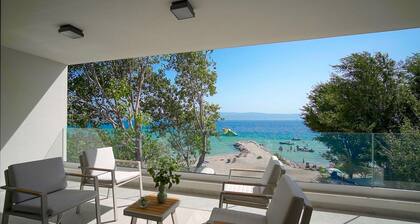 Beachfront Villa Erce with private 40sqm heated pool, a Gym, 7 en-suite bedrooms, a rooftop terrace, 2 living areas