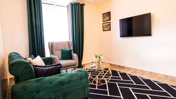 Deluxe Apartment | Living area | 20-inch Smart TV with digital channels, TV