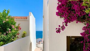 A narrow white-walled pathway leading to a balcony overlooking the sea. - Albufeira Sea View 25 (Albufeira)
