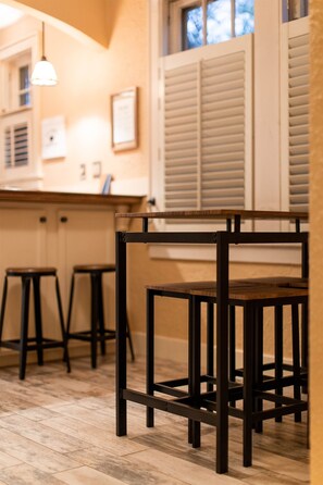 Enjoy meals at the kitchen bar with comfortable seating for two.