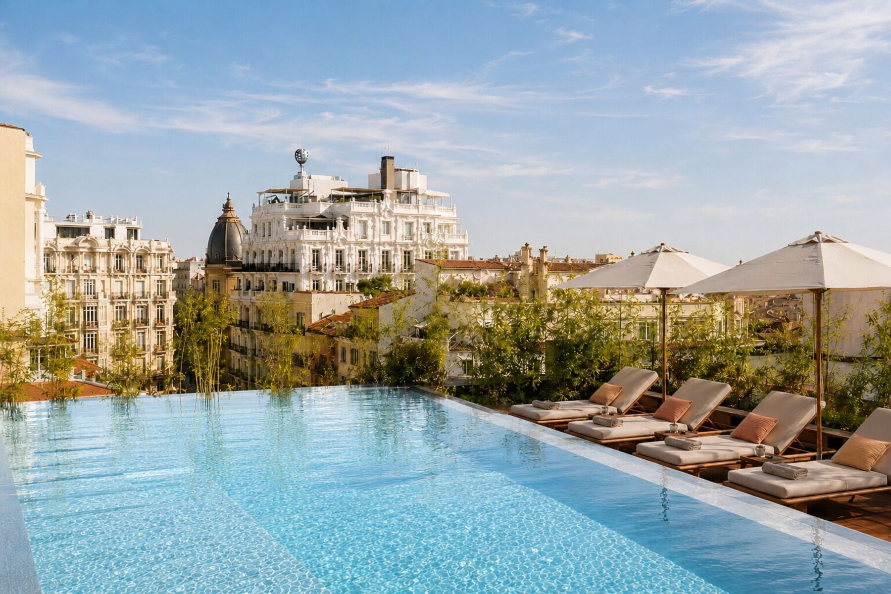Seasonal outdoor pool, open 11:00 AM to 9:00 PM, pool umbrellas