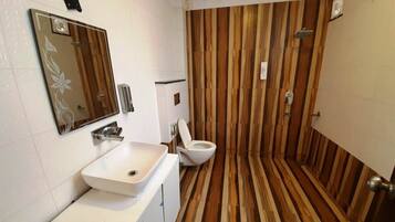 Bathtub, towels, soap, toilet paper