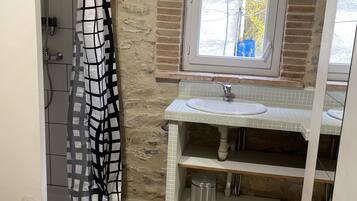 Shower, hair dryer, towels, toilet paper