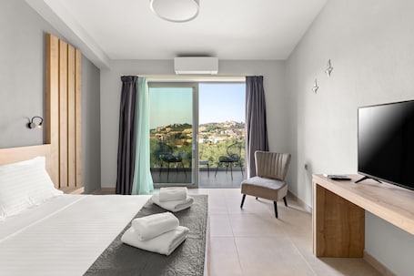 Premium bedding, pillow-top beds, laptop workspace, blackout curtains. Sarah Luxury Rooms