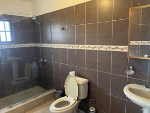 Shower, towels, soap, toilet paper