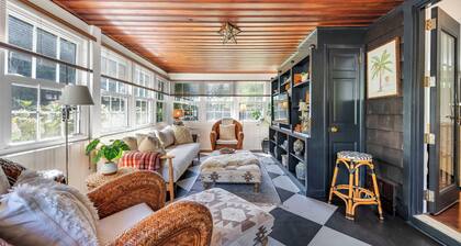 Beautiful cottage on meticulously maintained lawn, surrounded by...