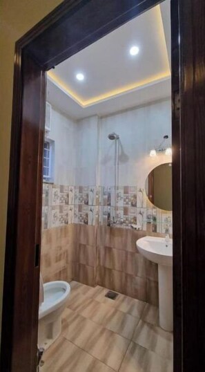 Shower, towels - MIDWAY HOTEL & RESIDENCY - Studio Apartment Unit S2 (Lahore)