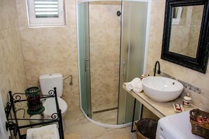 Bathtub, hair dryer, towels, soap