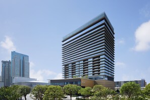 A modern hotel with a distinctive angular design, featuring multiple floors and a glass facade. - The Westin Yokohama (Yokohama)