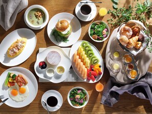 A breakfast buffet with various dishes including eggs, fruits, pastries, and beverages. - The Westin Yokohama (Yokohama)