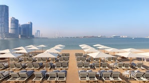 Private beach, white sand, sun loungers, beach umbrellas - voco Dubai the Palm by IHG (Dubai)