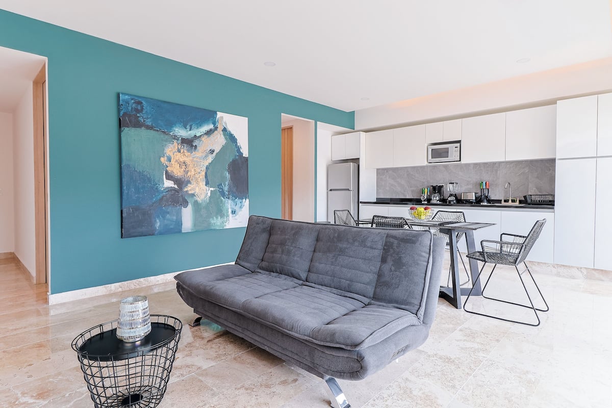 Deluxe Suite | Living area | 50-inch TV with digital channels, streaming services