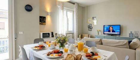 A breakfast setup with a TV in the background.