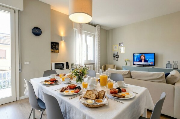 A breakfast setup with a TV in the background.