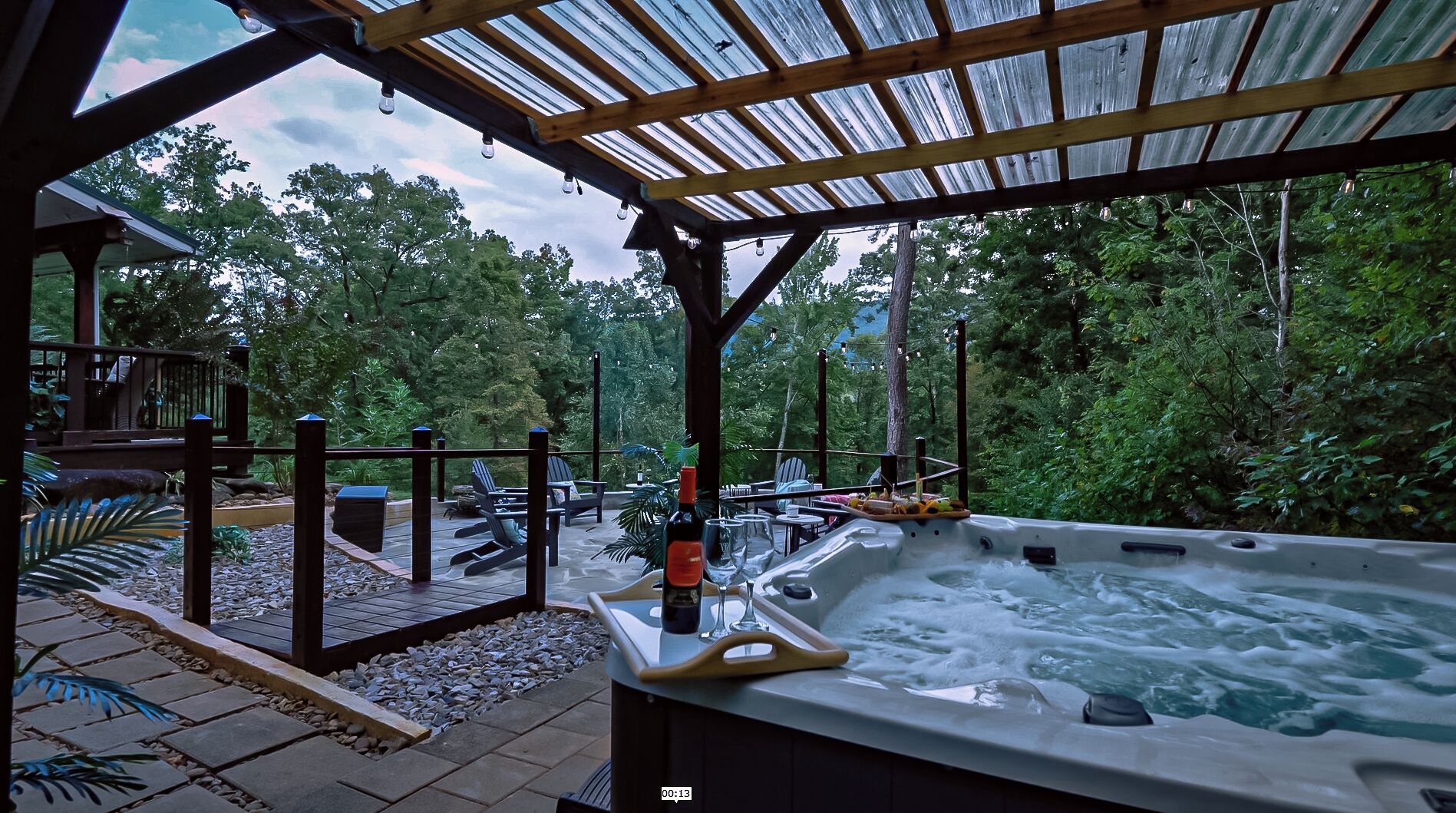 Unwind in the spa-like hot tub or gather by the custom flagstone firepit