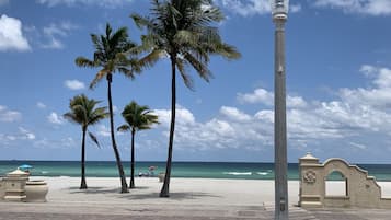 On the beach, sun loungers, beach towels, 2 beach bars