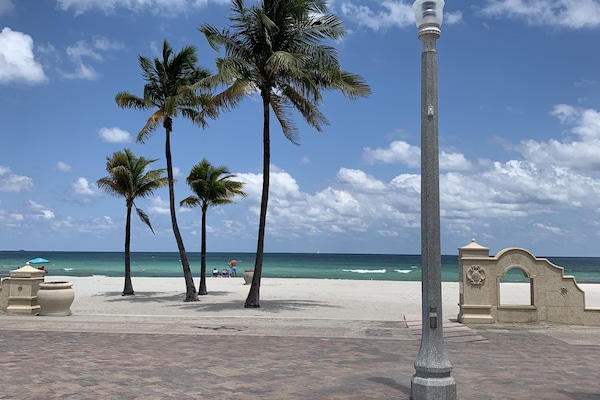 On the beach, sun loungers, beach towels, 2 beach bars