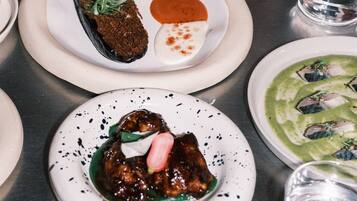 A variety of dishes on plates, suggesting a dining setting.