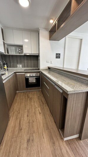 Apartment | Private kitchen | Full-size fridge, microwave, oven, stovetop