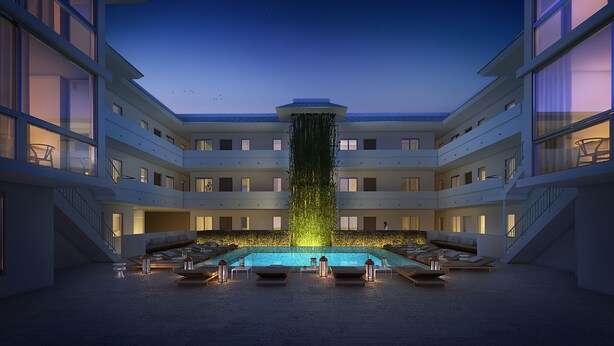 Un hotel moderno con piscina central, varios balcones y una cascada.