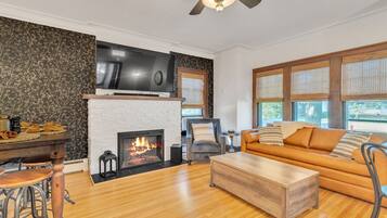 Smart TV, fireplace, foosball, books