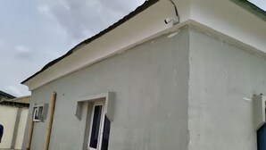 A building with a white exterior and a visible window. - Elegantly Apportioned 4-bed House in Ikorodu (Ikorodu)