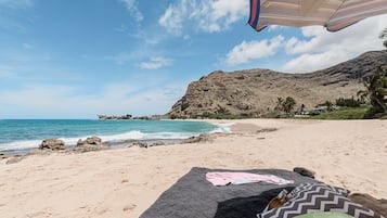 On the beach, sun loungers, beach towels