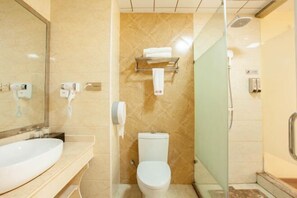 A bathroom with a sink, toilet, and glass shower enclosure. - Shangcheng lijingyuan Hotel (Shangcheng)