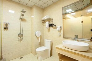A bathroom with a toilet, a sink, a mirror, a towel rack, and a shower. - Shangcheng lijingyuan Hotel (Shangcheng)