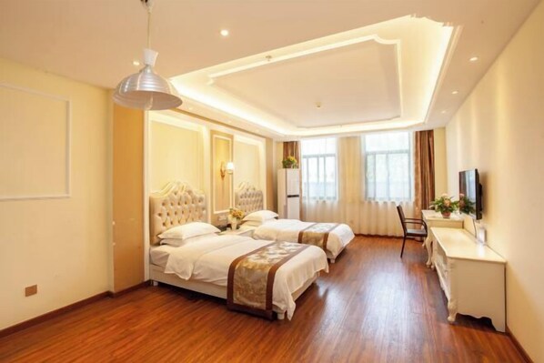 A hotel room with two beds, a desk, a TV, and a large window. - Shangcheng lijingyuan Hotel (Shangcheng)