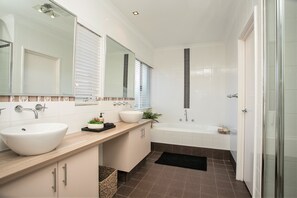 Bathtub, hair dryer, towels, soap
