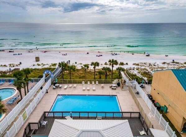 Relax by the pool or take a short walk to the beach.
